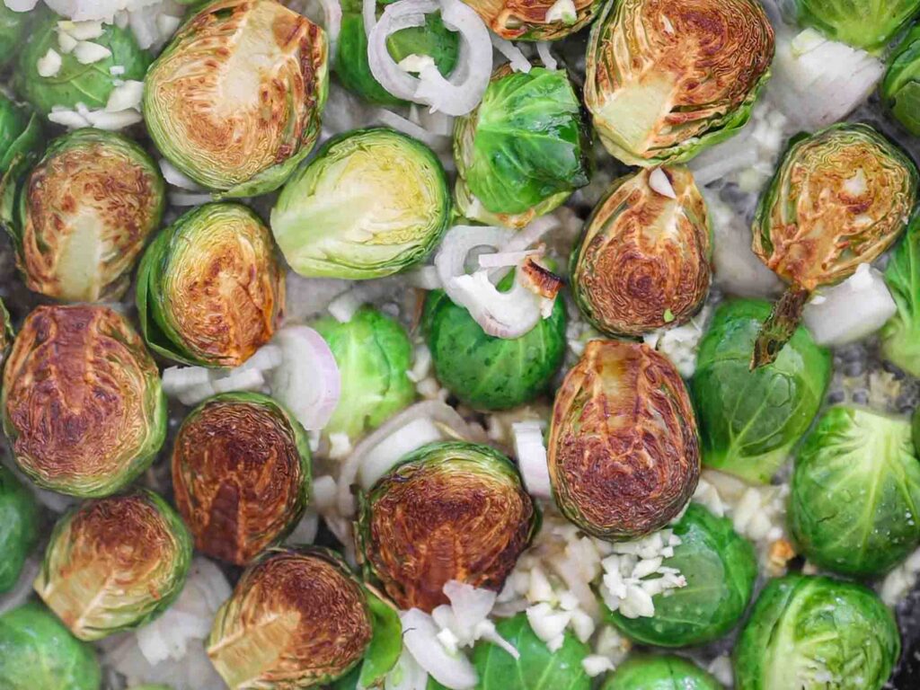 seared brussels sprouts in wine reduction and shallots